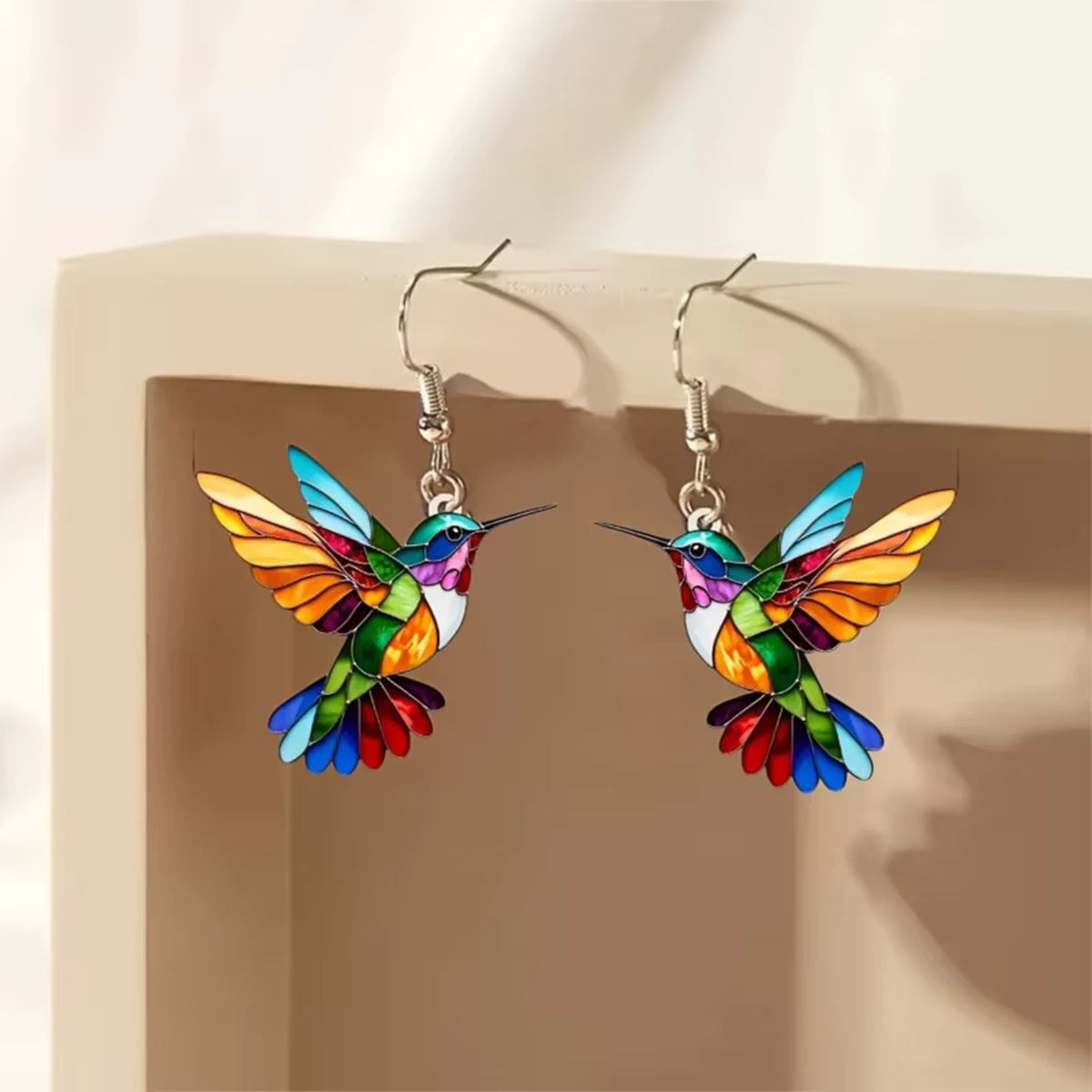 Hummingbird earrings on a box