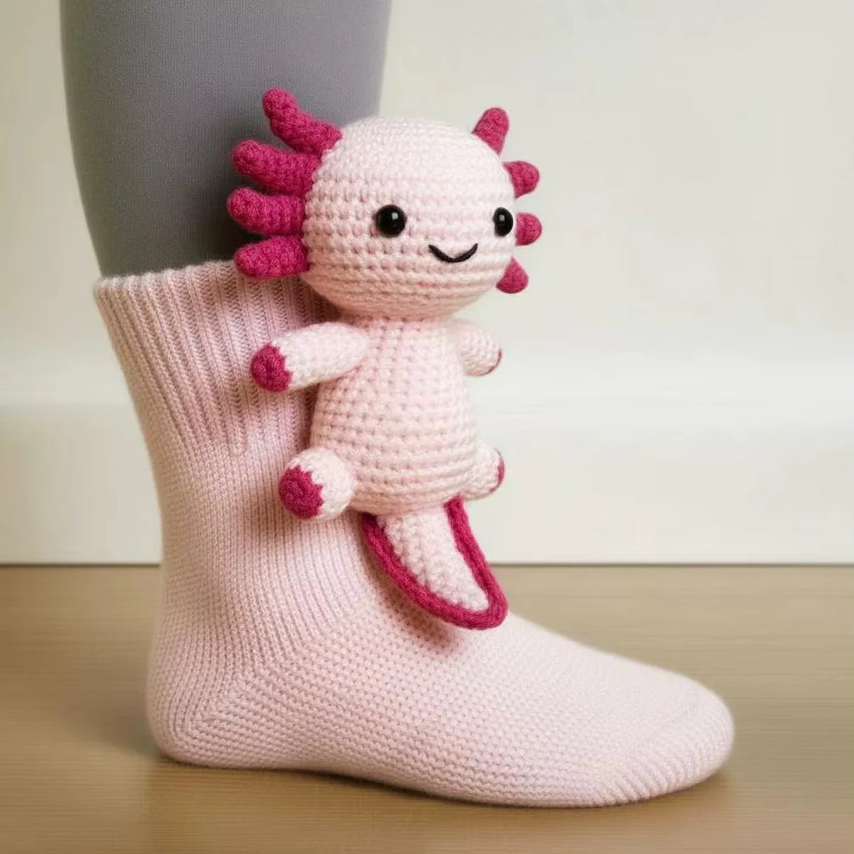 Rosie the Axolotl hand-knit cosy sock